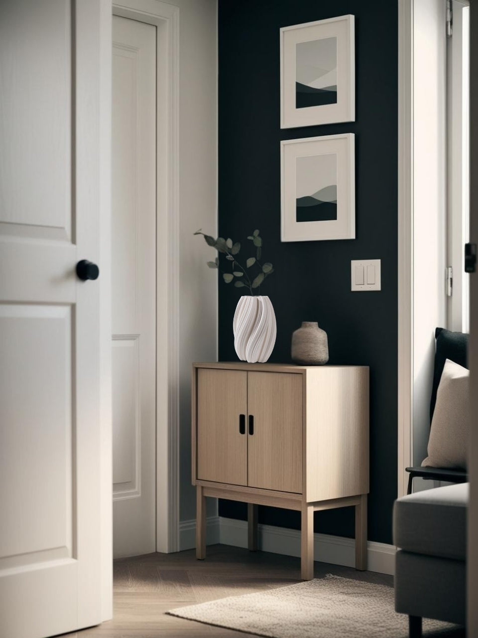 White 3D printed geometric vase on a entryt table in a dark minimalist entry
