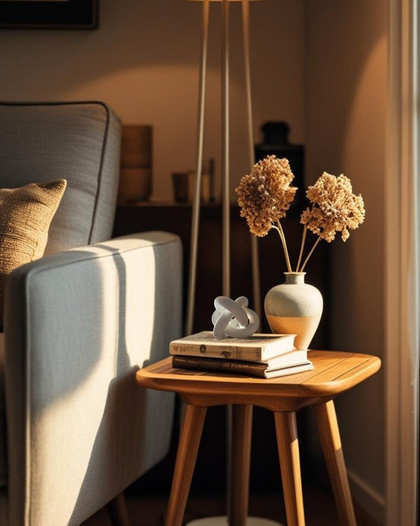 Wooden end table with decorative knot in a cozy living room setting