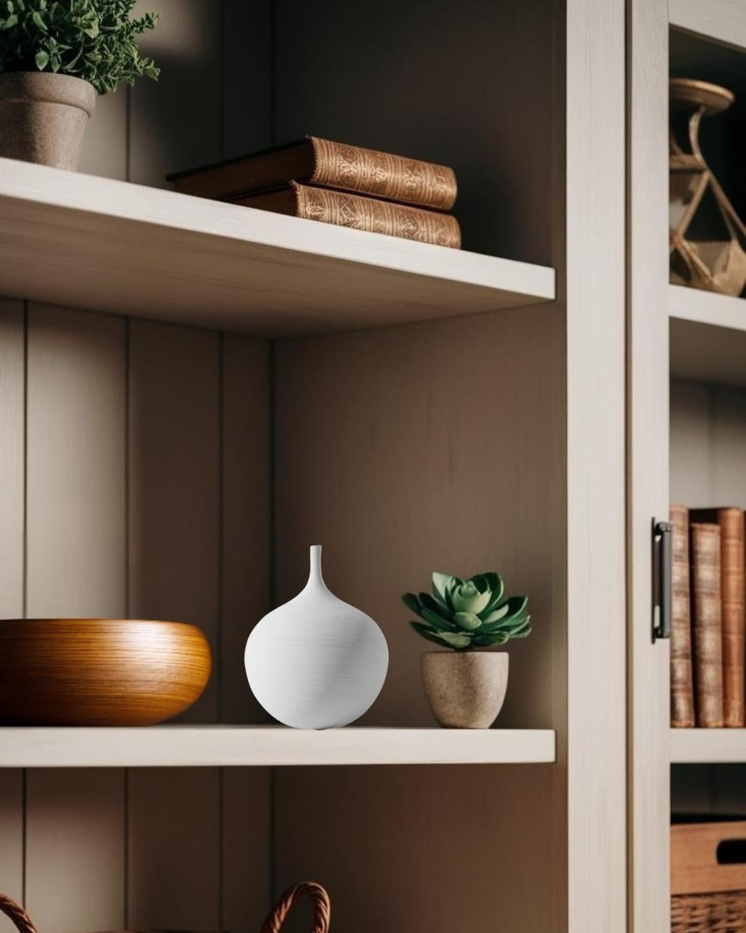 White vase on bookcase in a  farmhouse living room 