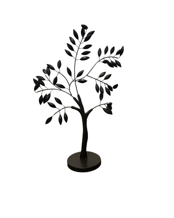 Black metal tree-shaped decorative accent on white background.