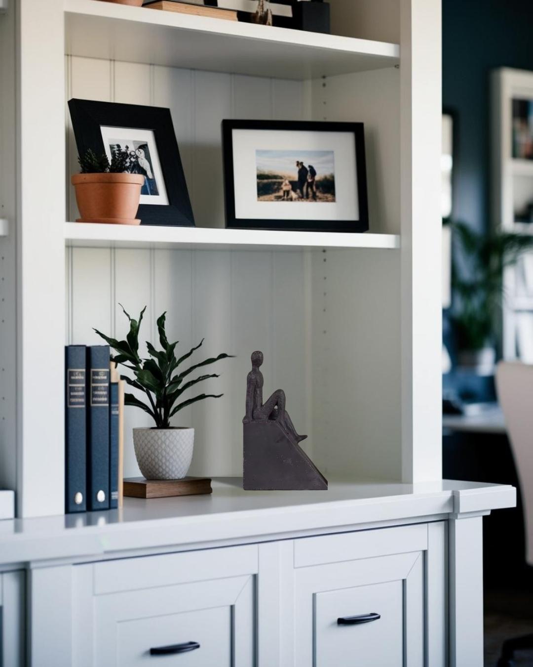 White modern human figure on bookcase in a Japandi style living room