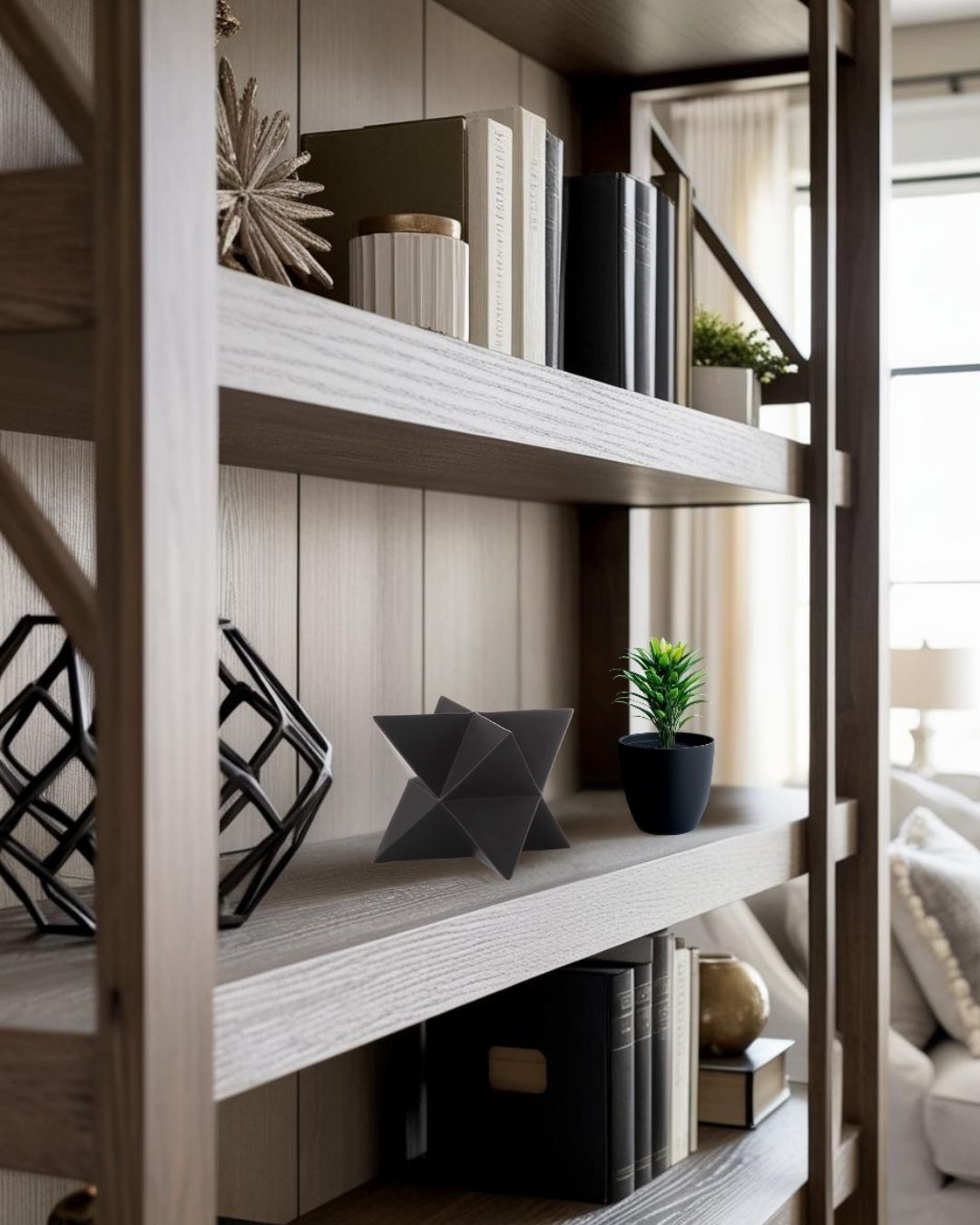  black star geometric decorative accent on shelf with neutral decor in farmhouse living room