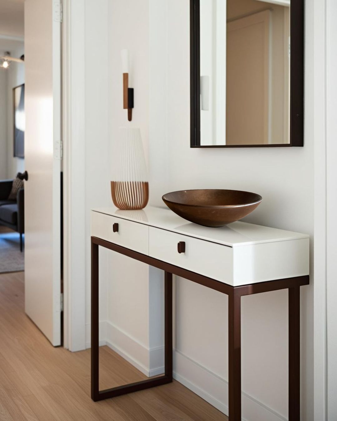 Brown porcelain bowl on a white entry table in a farmhouse entry