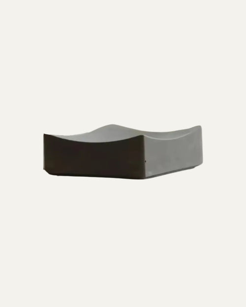 Curved concrete valet tray in minimalist design, isolated on white background