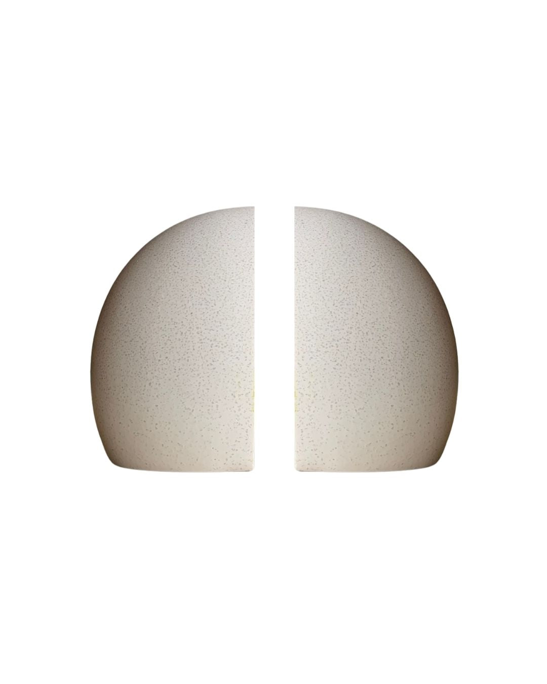 Front view of sculptural white modern bookend isolated on white background