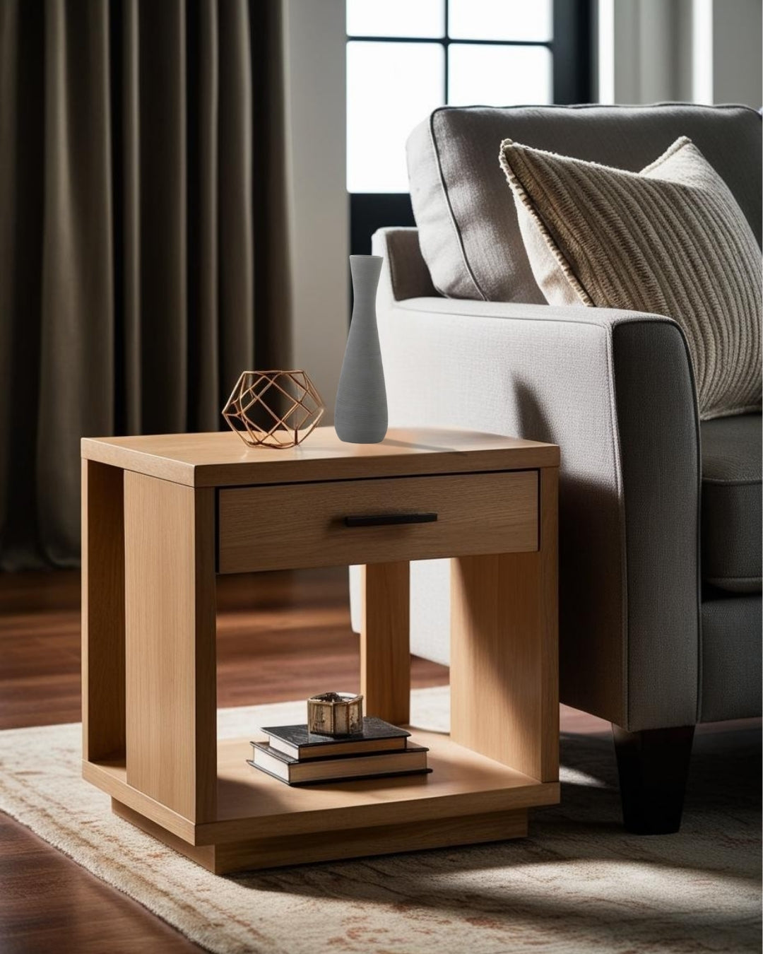 Gray vase on a light end table in a bright minimalist living room space with natural light