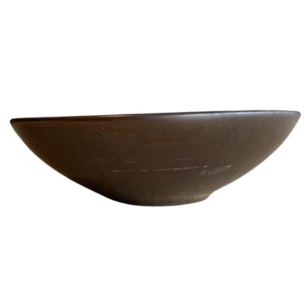 Handcrafted brown porcelain bowl side view on white background
