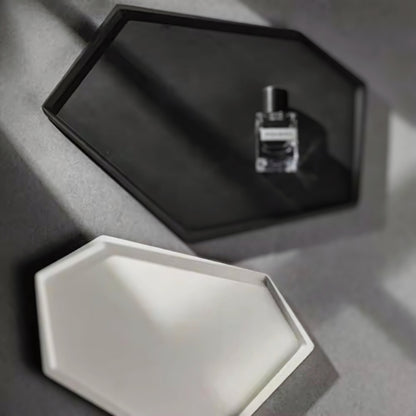 Black and white hexagonal nordic minimalist decorative trays, with a perfume bottle placed on the black tray.