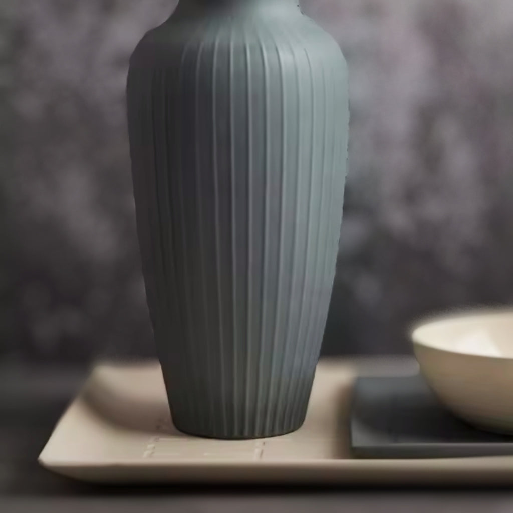 Minimalist beige ceramic tray with clean lines, displayed on a dark textured surface.