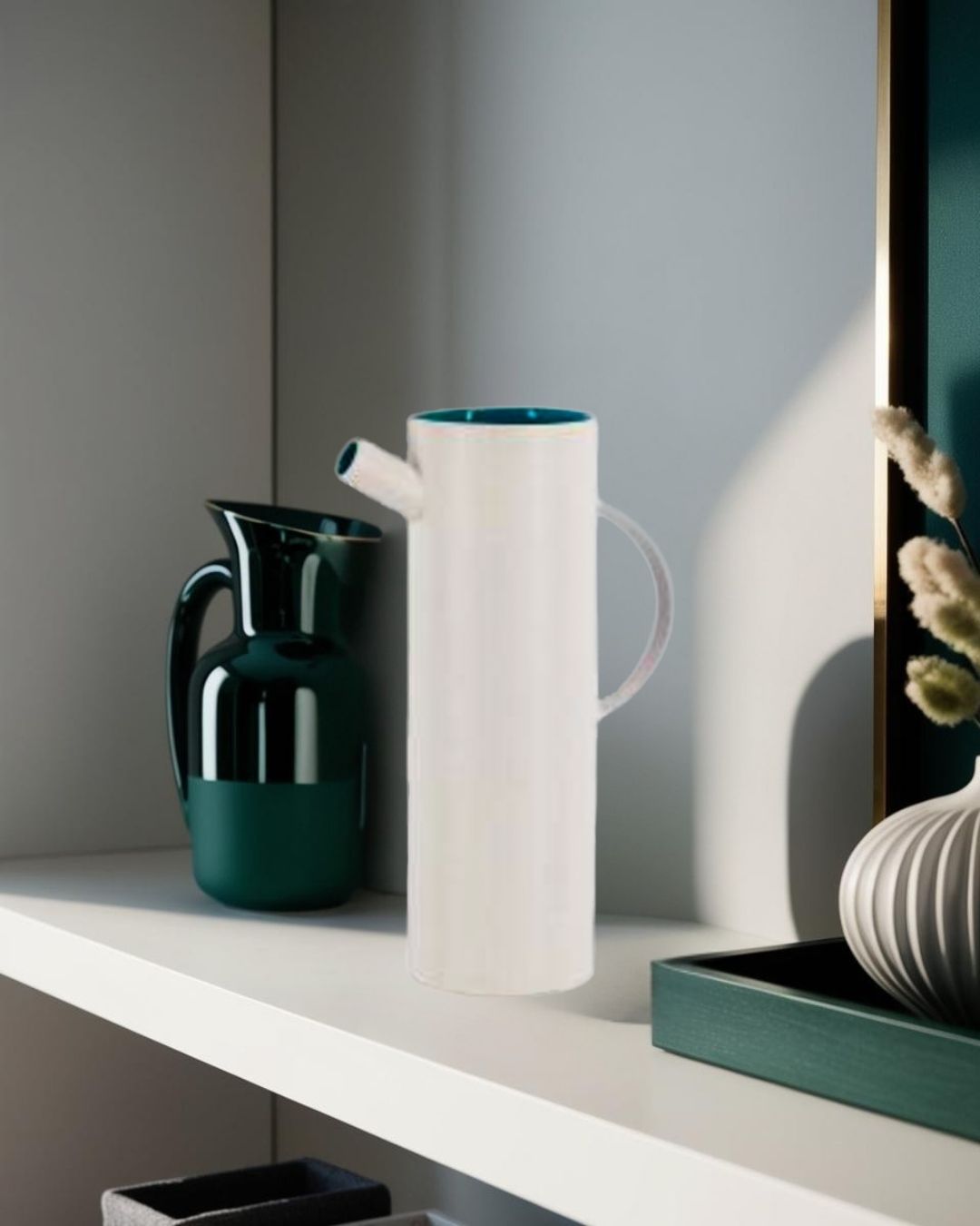  White decorative pitcher on shelf next to dark ceramic accents