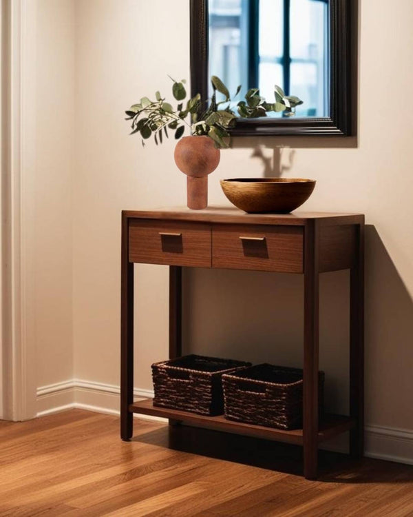 Ochre terracota ceramic vase on a small entry table in a minimalist entry