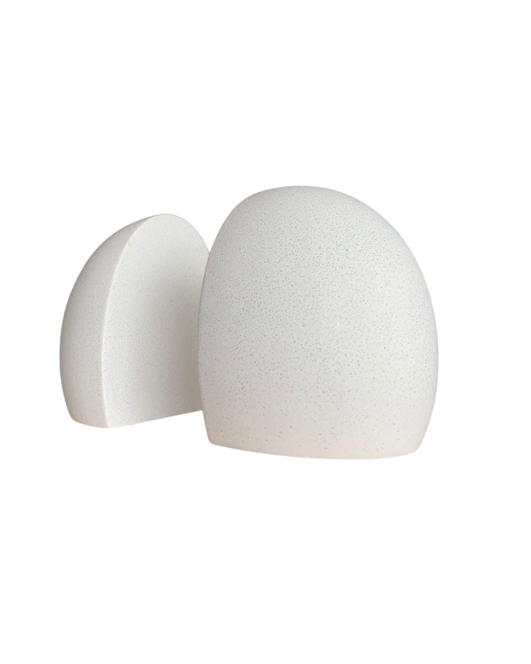 Pair of sculptural white bookends in minimalist style, angled view isolated on white background