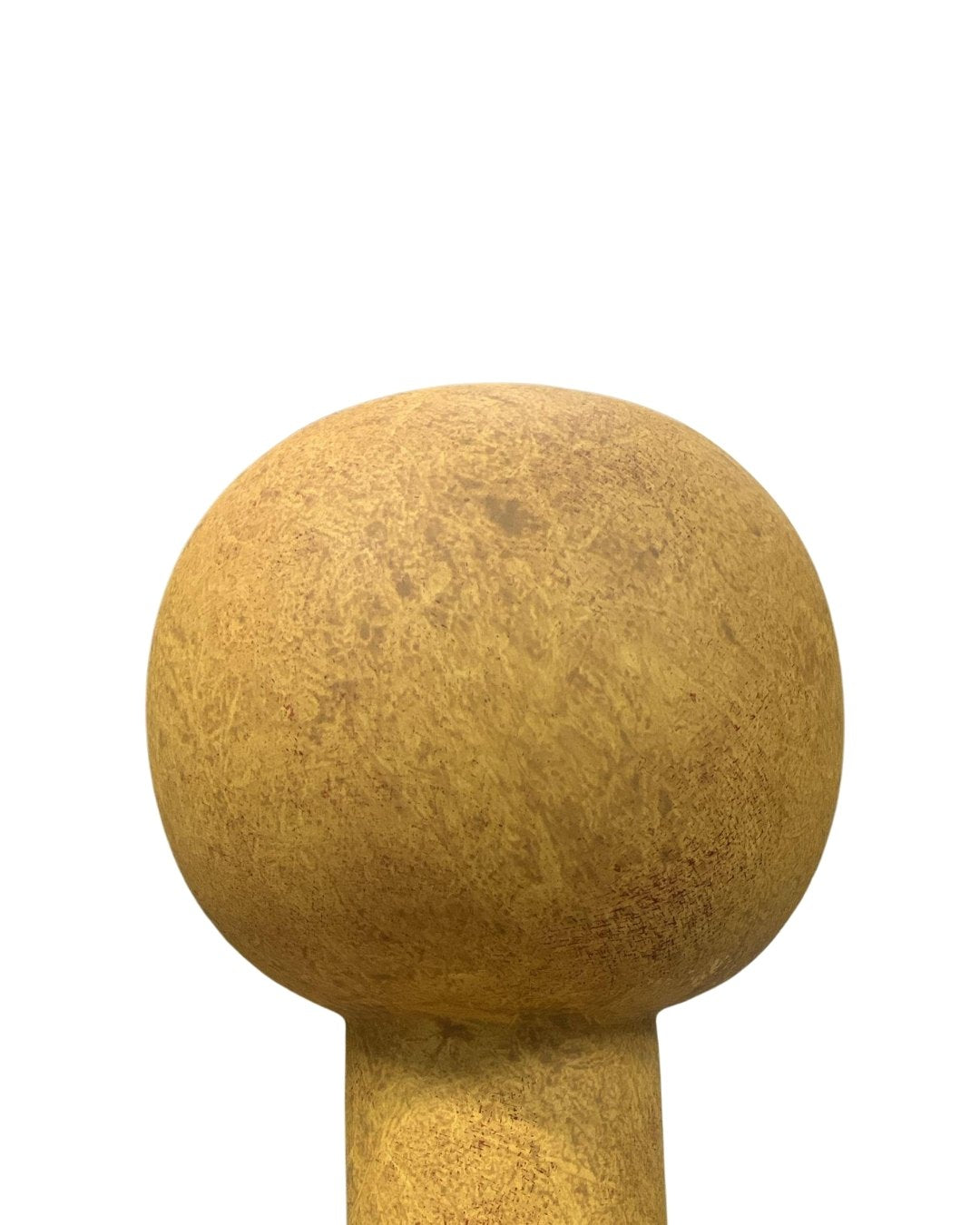 Close-up of an ochre yellow sculptural vase with textured finish