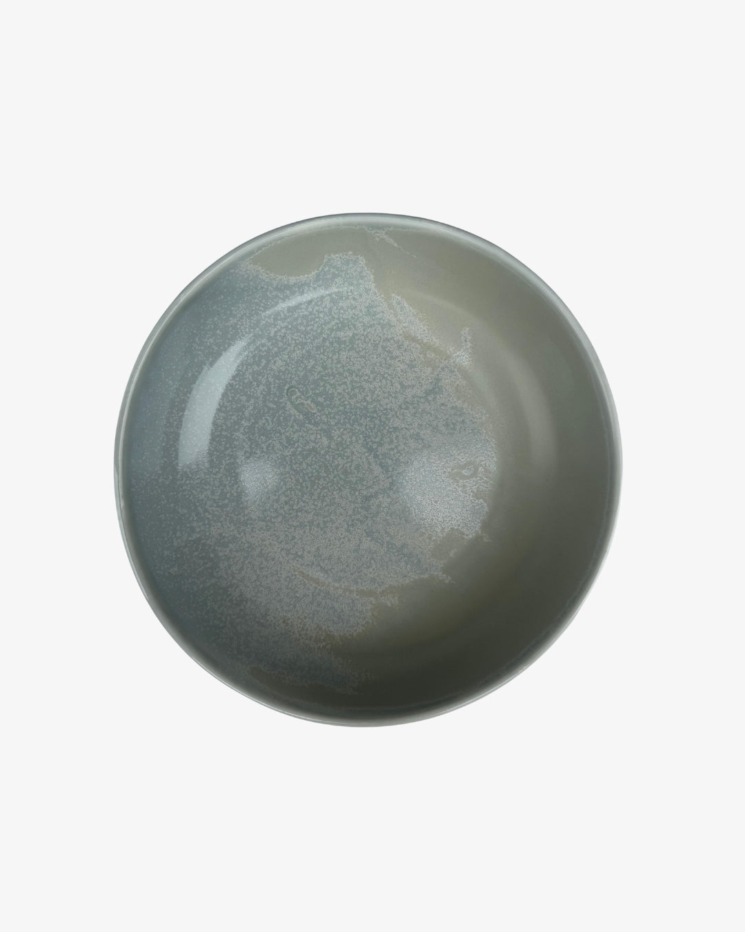 Plato hondo Rifletskal gris de porcelana con interior esmaltado en degradado, visto desde arriba sobre fondo claro.