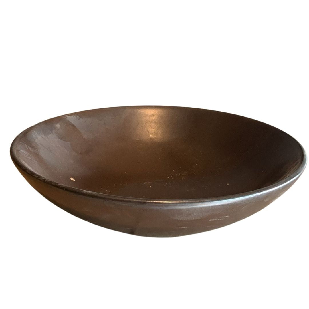 Rustic brown porcelain bowl photographed from top angle on white background