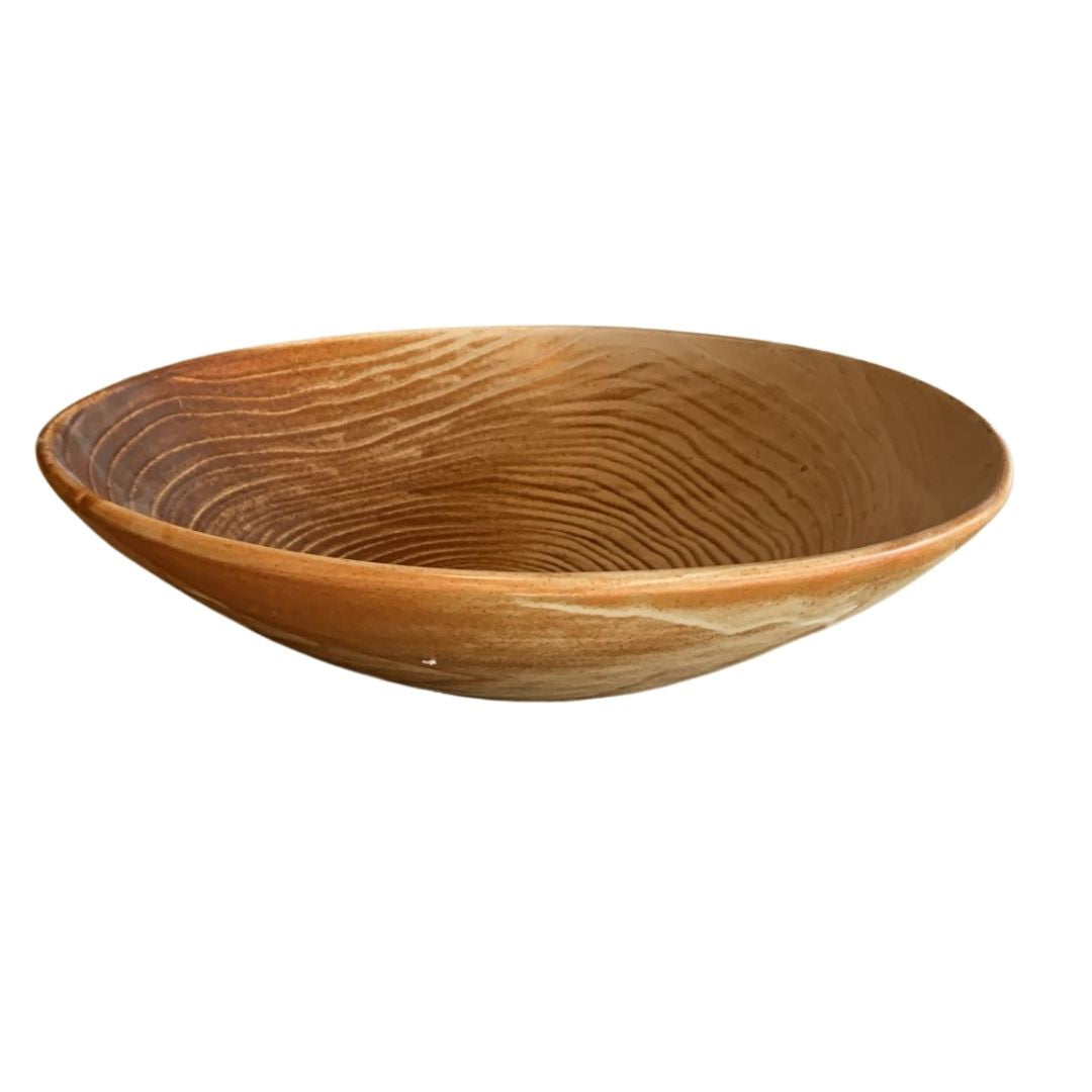 Top view of rustic brown porcelain bowl with reactive glaze isolated on white background
