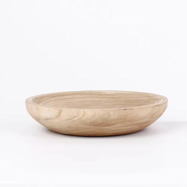 Rustic wooden bowl displayed on a plain white background
