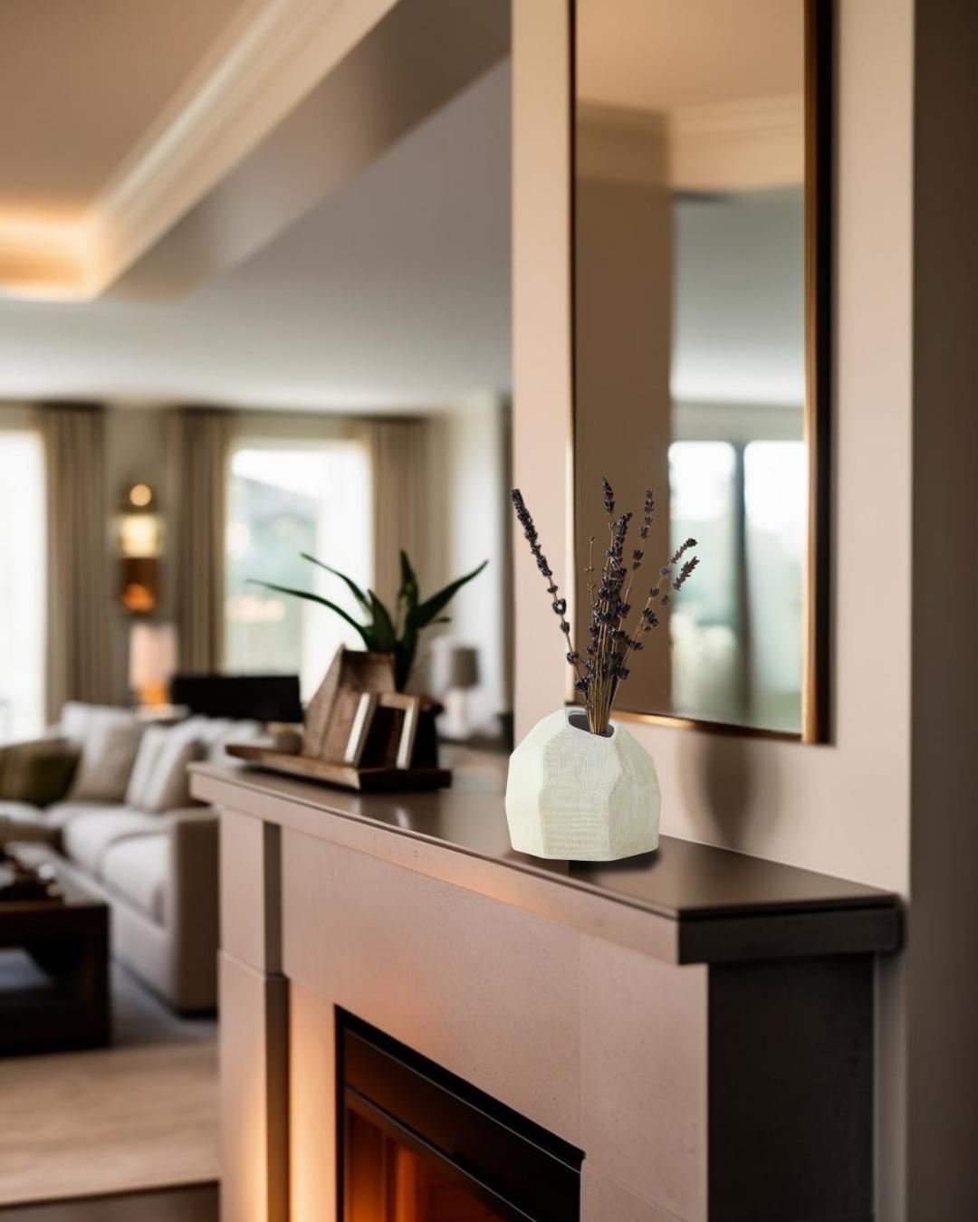 Sculptural white ceramic vase on fireplace mantel in a farmhouse style interior

