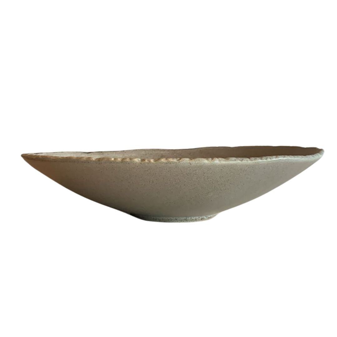 Shallow gray rustic porcelain bowl side view on white background