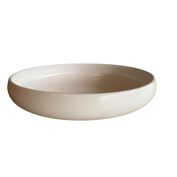Shallow white porcelain bowl front view on white background