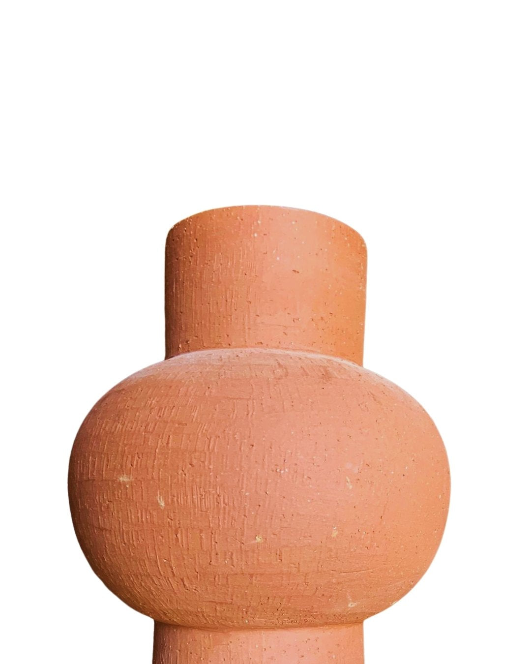Side view cutout of a sculptural terracotta vase with unique rounded shape