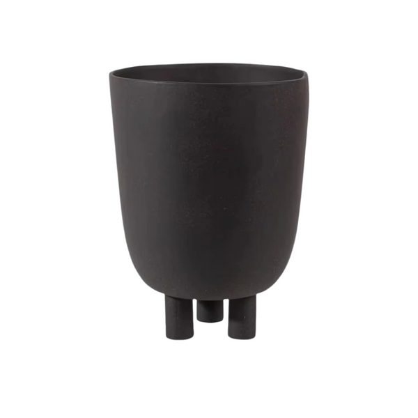 Cutout of a small black ceramic vase with short legs and matte finish