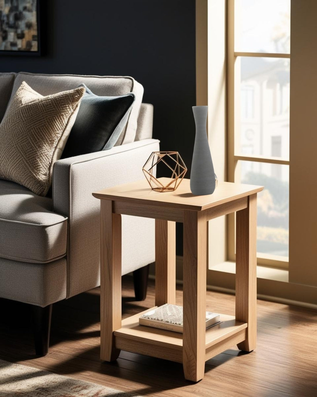 Tall gray vase on a wooden end table next to a sofa in a minimalist living room