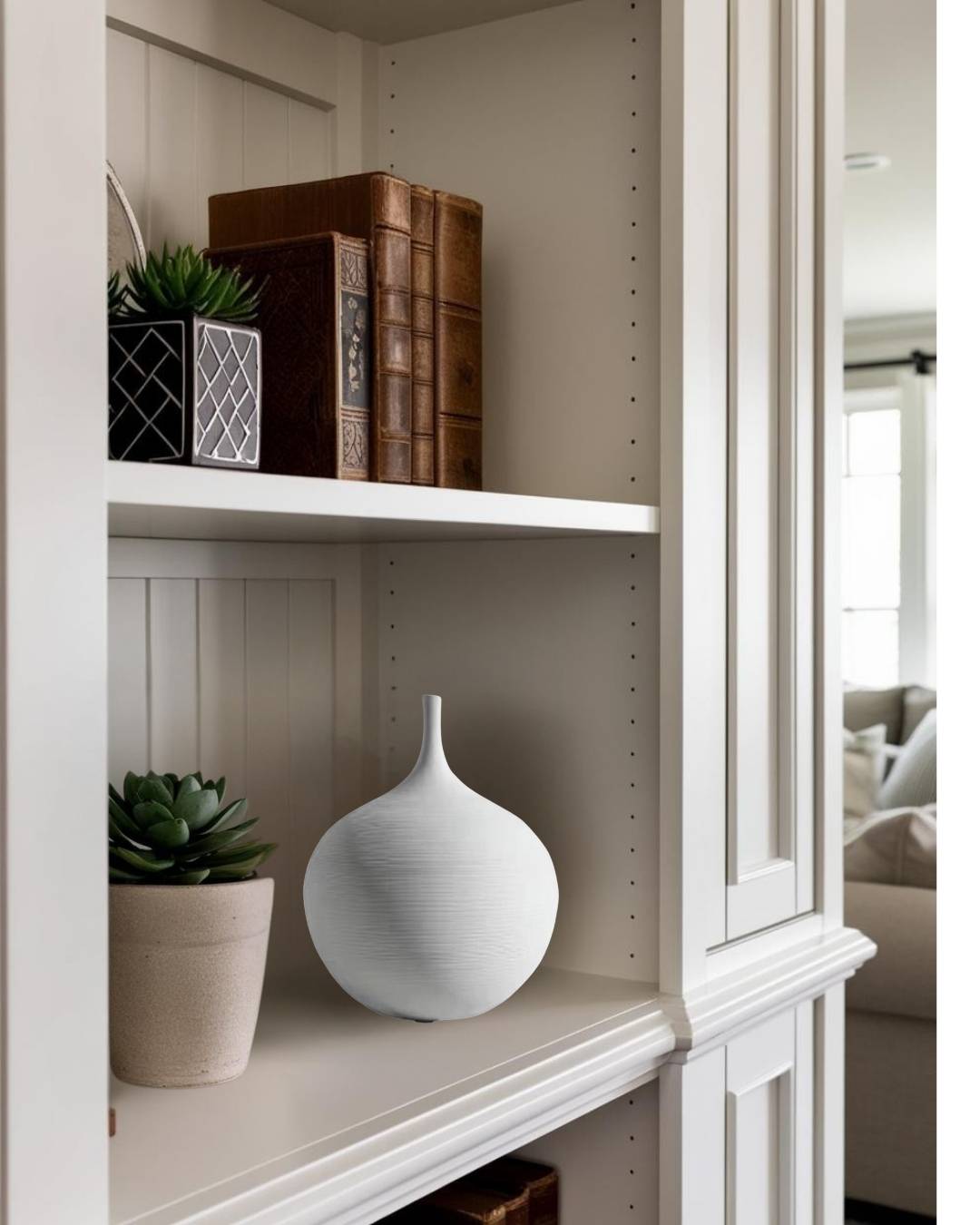 White ceramic vase on bookcase in a compact transitional living room