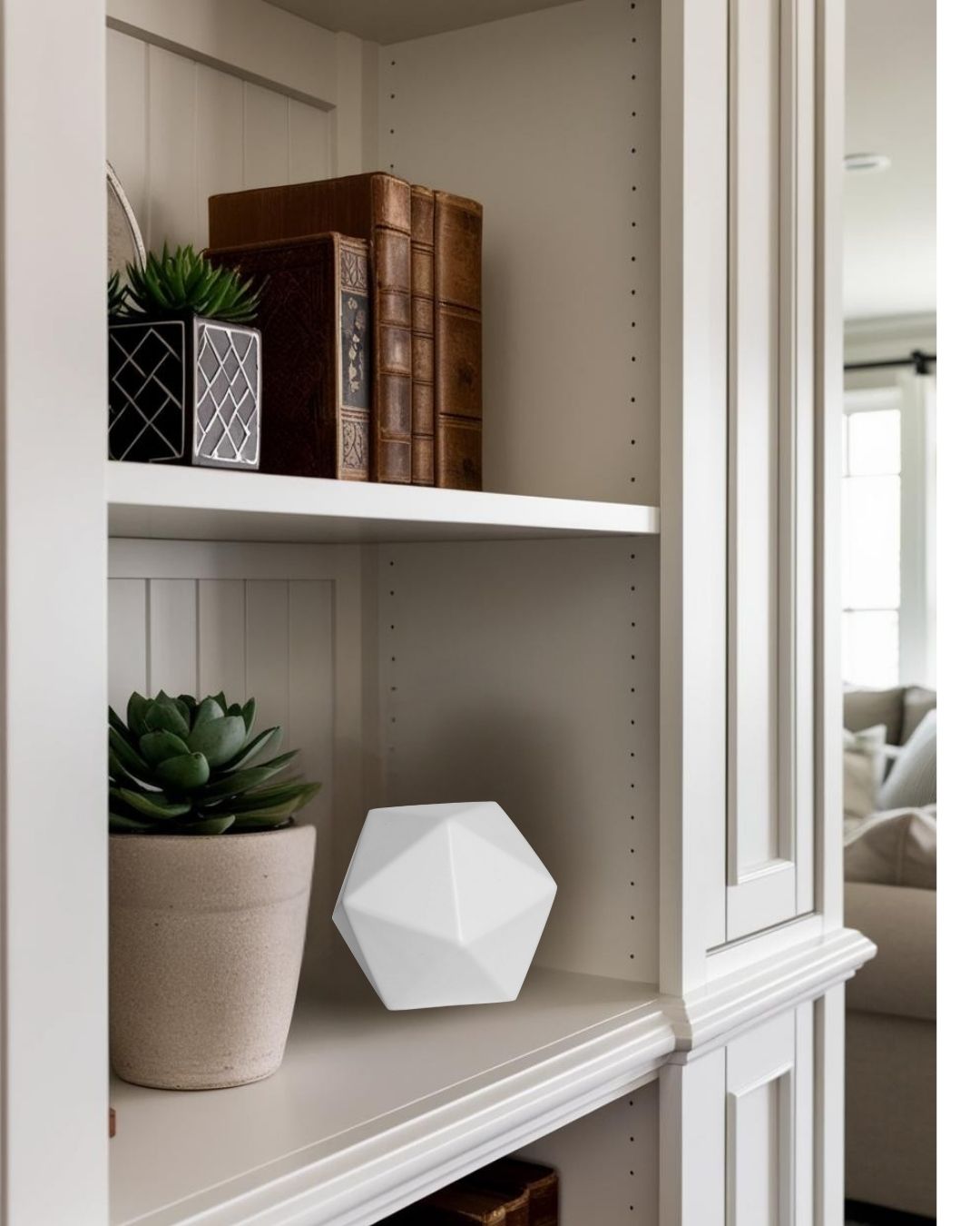 White geometric accent on wood shelf with plant in a bright farmhouse living room