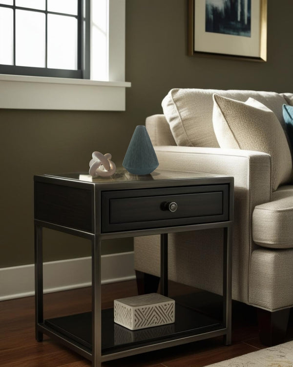White geometric knot accent on black end table beside neutral farmhouse sofa in lving room