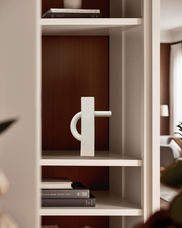 White rectangular ceramic decorative pitcher on shelf in a Japandi style living room