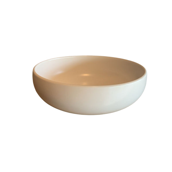 Side view of white shallow porcelain decorative bowl isolated on white background