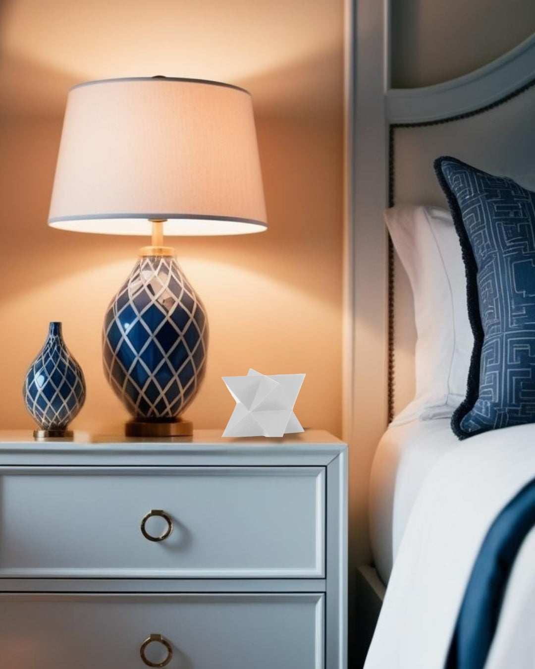 White star-shaped geometric accent on light blue nightstand with lamp in farmhouse style bedroom