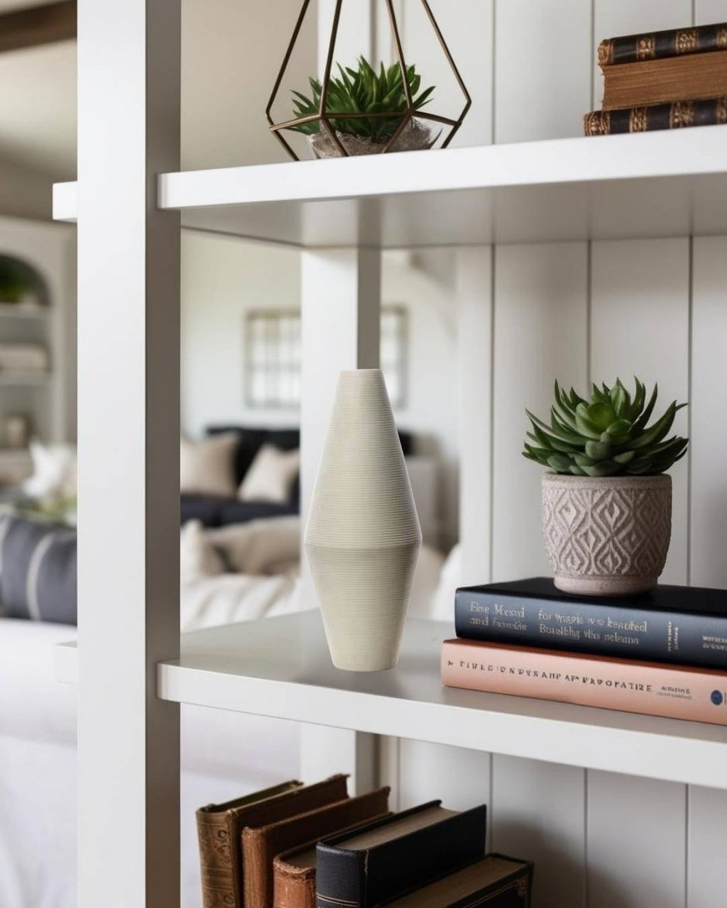 White vase and plants on shef in a compact farmhouse living room in a house

