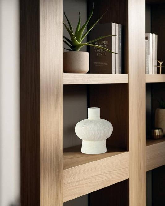 White vase on bookcase in a Japandi living room

