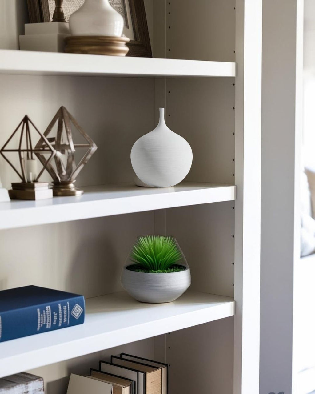 White vase on bookcase in a compact farmhouse living room

