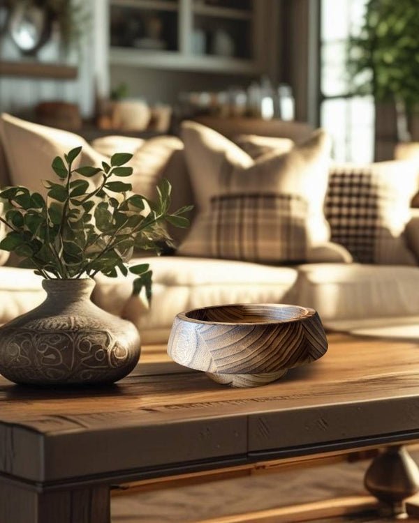 Wooden decorative bowls on a coffee table in a rustic farmhouse style living room with neutral tones and textured decor